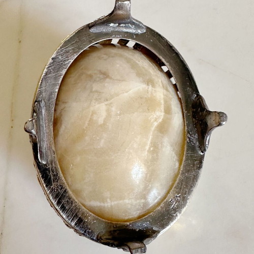 Vintage decorative egg from natural onyx stone in carved silver-plated base used