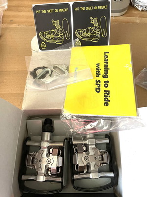 Shimano PD-M323 hybrid bicycle pedals with dual clipless and platform sides