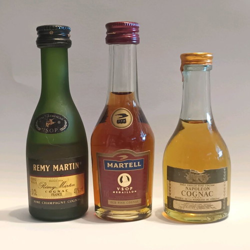 7 miniature cognac bottles, sealed, pack