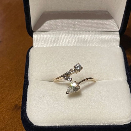 Women's 14K gold ring like new with round cut and pear-shape stones