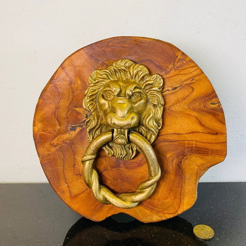 Bronze door knocker used with lion head and wooden base