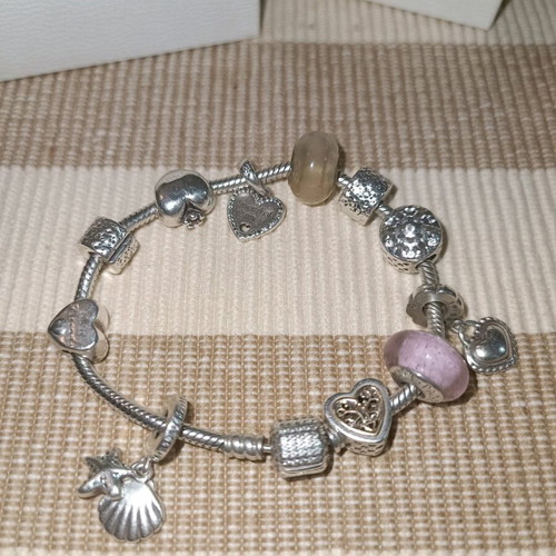 Pandora silver bracelet with 11 charms and collectible clasp, like new