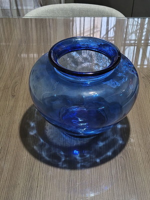 Blue glass vase, deep color and wide round shape