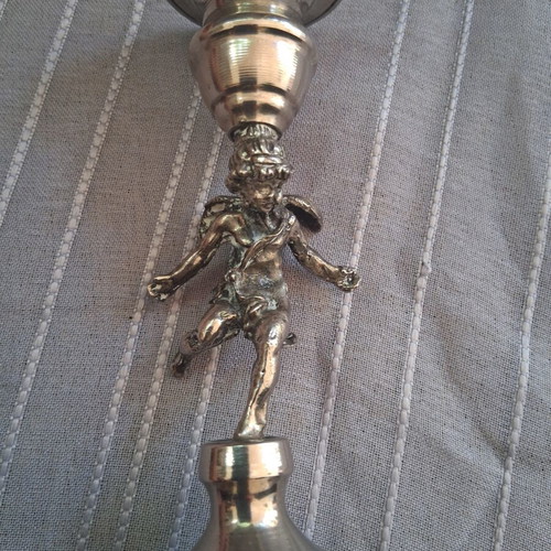 Vintage candlestick with cherub figure