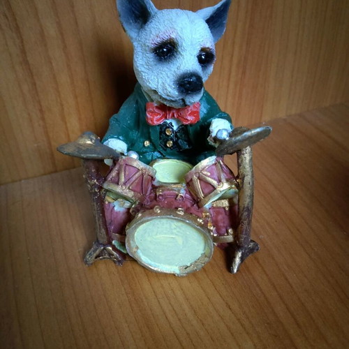 Decorative dog figure with drums like new