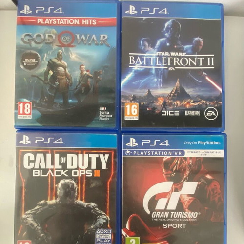 PlayStation 4 Slim 500GB used with 2 controllers and 4 games