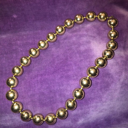 Necklace with gold-colored beads used, clasp needs replacement