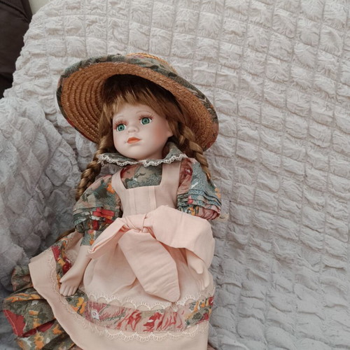 Collectible porcelain doll with straw hat 40 cm, used