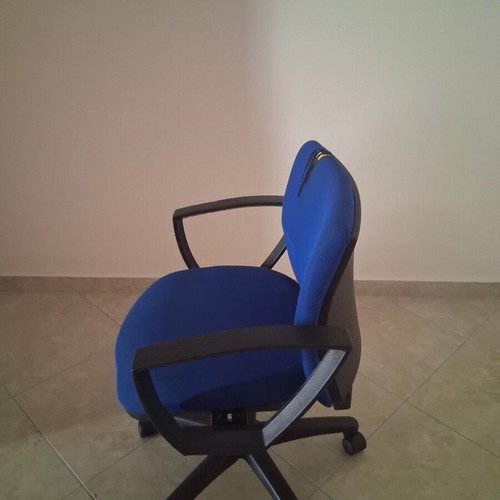 Office chair with fabric defect