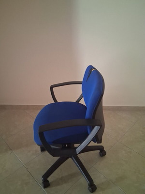 Office chair with fabric defect