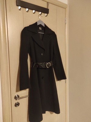 Black coat used, mid-length with collar and patent leather belt