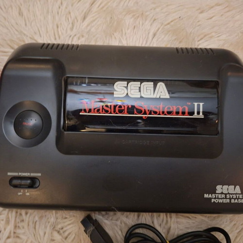 Sega Master System II used with 2 cartridges and new power supply