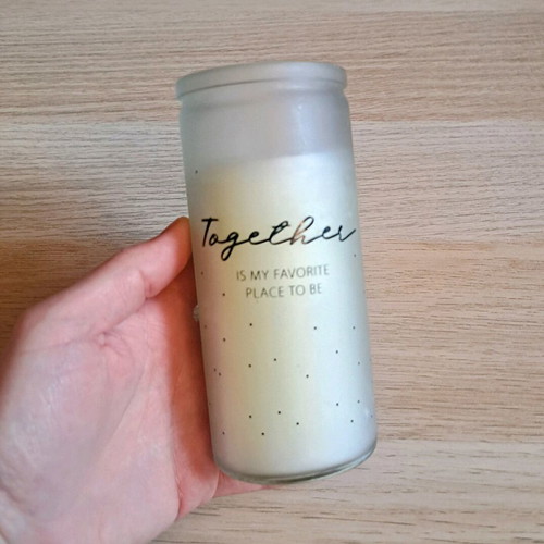 White candle in container new