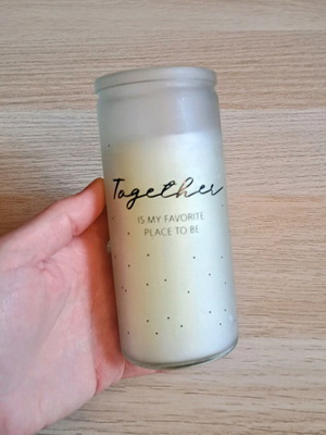 White candle in container new
