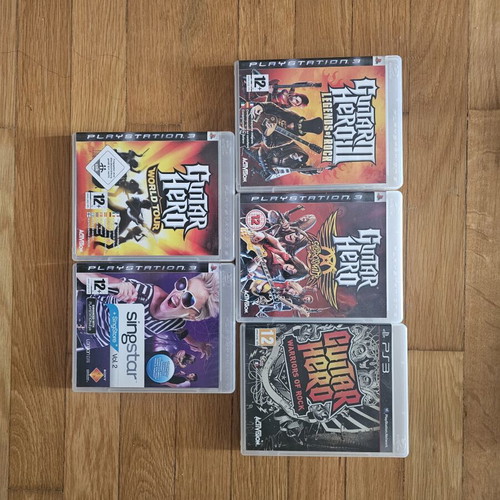 Drums Logitech, Guitar Hero guitar, microphone and 5 used PlayStation 3 games
