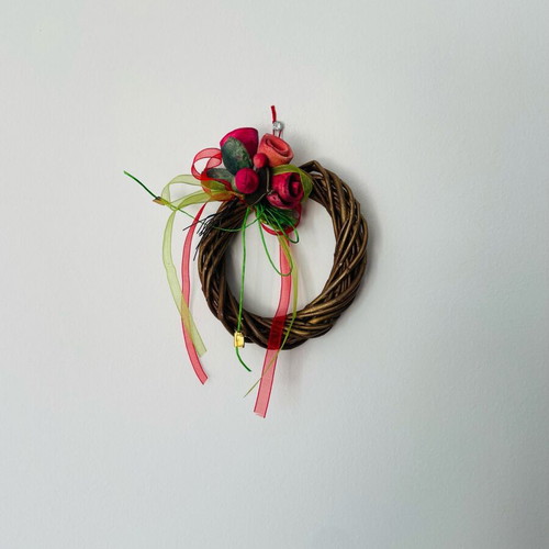 Handmade decorative wreath with ceramic flowers, like new