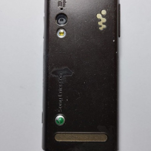 Sony Ericsson W715i mobile phone used, functional, with charger and headphones