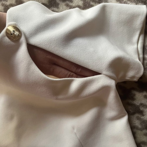 White top like new with cutouts and gold buttons size M
