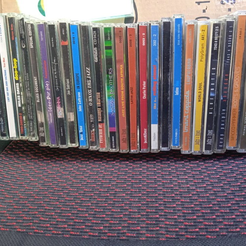 Foreign CDs used, pack of 25 with blues, jazz, latin, rock, soundtrack