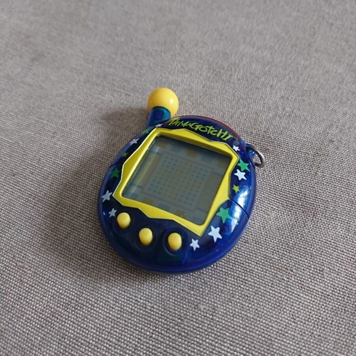 Bandai Tamagotchi Connection V4 used with star pattern blue case