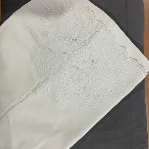 Single bed sheet set with grey fitted sheet and white embroidered pillowcase