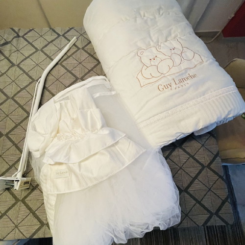 Guy Laroche crib bedding set used with blanket and mosquito net