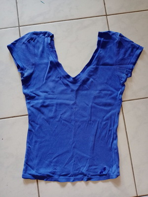 Blue short-sleeve shirt used with open V neckline