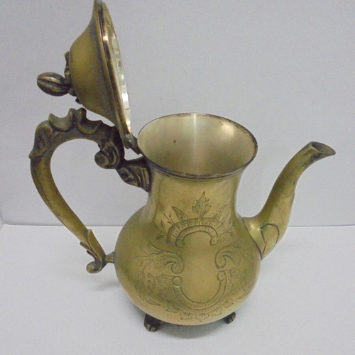 Old bronze teapot with decorative ornaments
