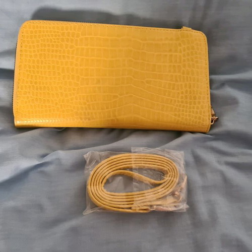 Yellow wallet used with strap