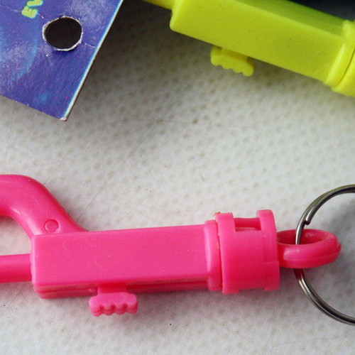 Card with 12 vintage 1980s phosphorescent key chains, new