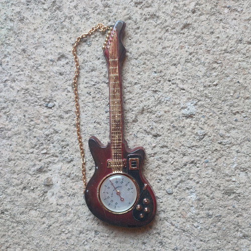 Antique thermometers used, cars and guitar