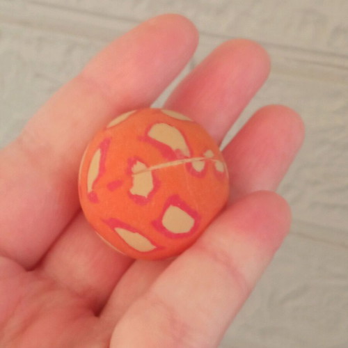Small orange ball used with design