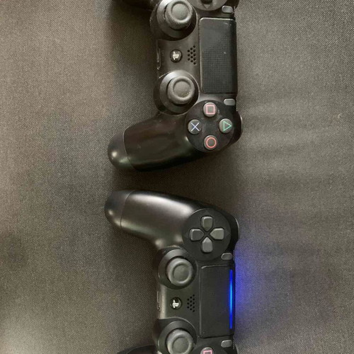 Sony PS4 500GB console with 2 controllers and 4 games