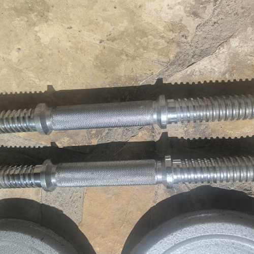 Dumbbell set used with weight plates for home training