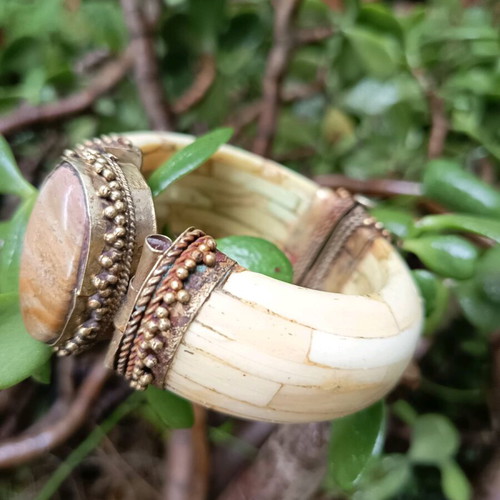 Boho bracelet used with bronze details beige