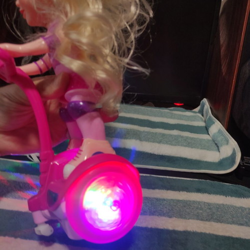 Doll with scooter, sound and lights, like new
