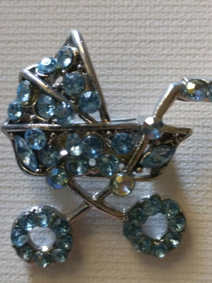 Brooch in baby carriage shape with blue beads new