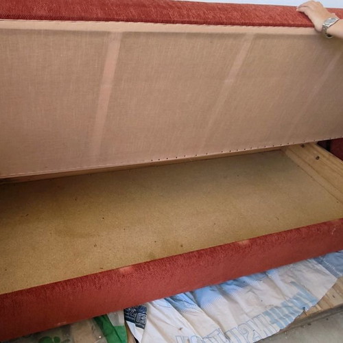 Three-seater sofa bed used with storage space