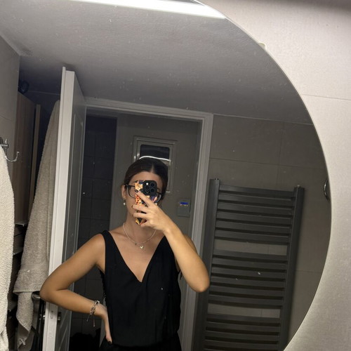 Pink Woman black jumpsuit with open back