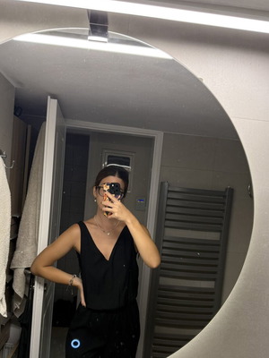 Pink Woman black jumpsuit with open back