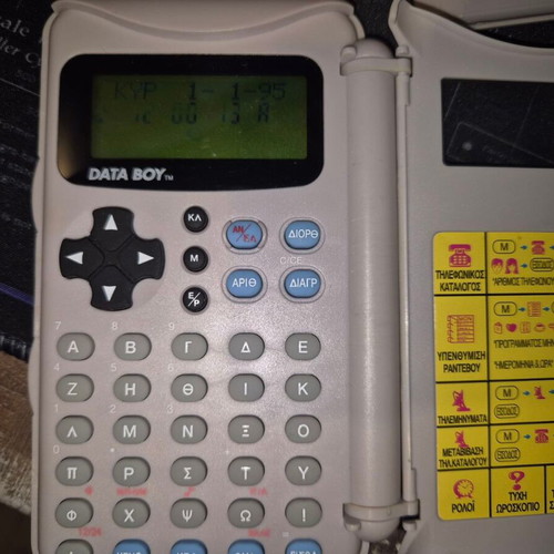 Data Boy handheld console used, powers on normally