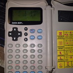 Data Boy handheld console used, powers on normally