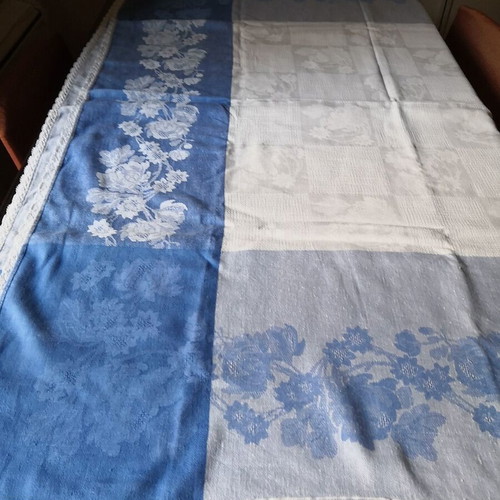 Aegean blue cotton tablecloth with floral woven patterns and lace trim