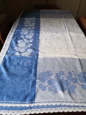 Aegean blue cotton tablecloth with floral woven patterns and lace trim
