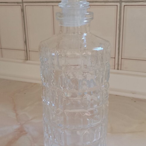 Glass decanter with stopper used, beveled design