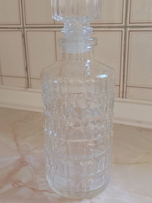 Glass decanter with stopper used, beveled design