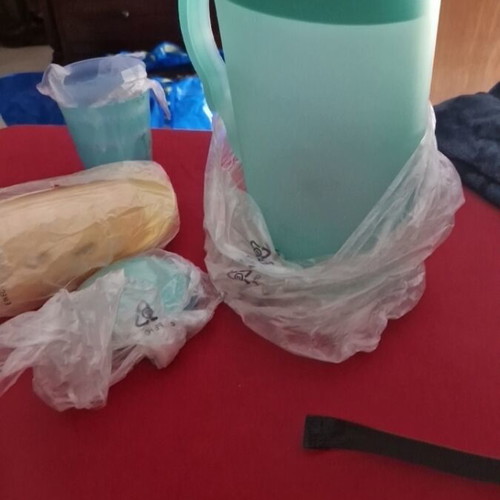 Tupperware pitcher with 4 glasses and lid new