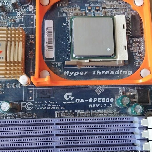 Gigabyte GA-8PE800 REV1.1 motherboard used with CPU, fan, and RAM