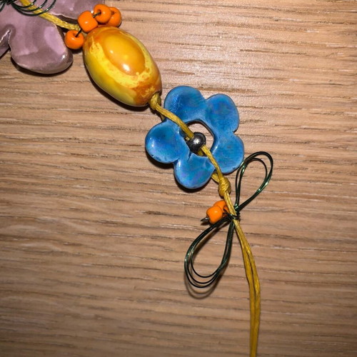 Chunky necklace used with floral metal and ceramic elements