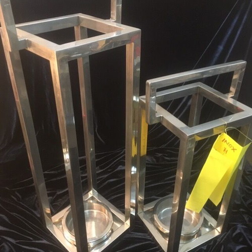 Stainless steel candlesticks used, floor and table
